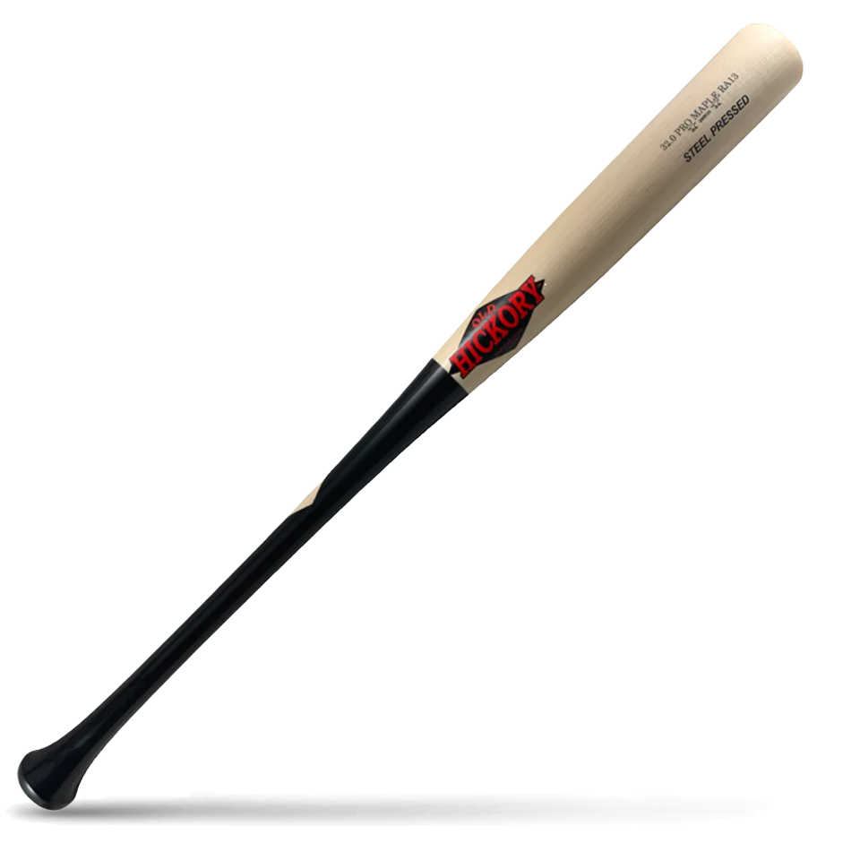 A baseball bat with a light natural wood barrel and a black handle, featuring the Old Hickory logo in red, lying diagonally on a white background with a shadow underneath.
